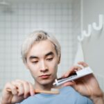 Photo by Ron Lach : https://www.pexels.com/photo/man-in-blue-crew-neck-shirt-putting-toothpa-on-his-toothbrushste-8160464/