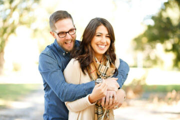 A happy couple enjoying a sunny day outdoors, representing one of the reasons why Denver is the ultimate city for a fresh start